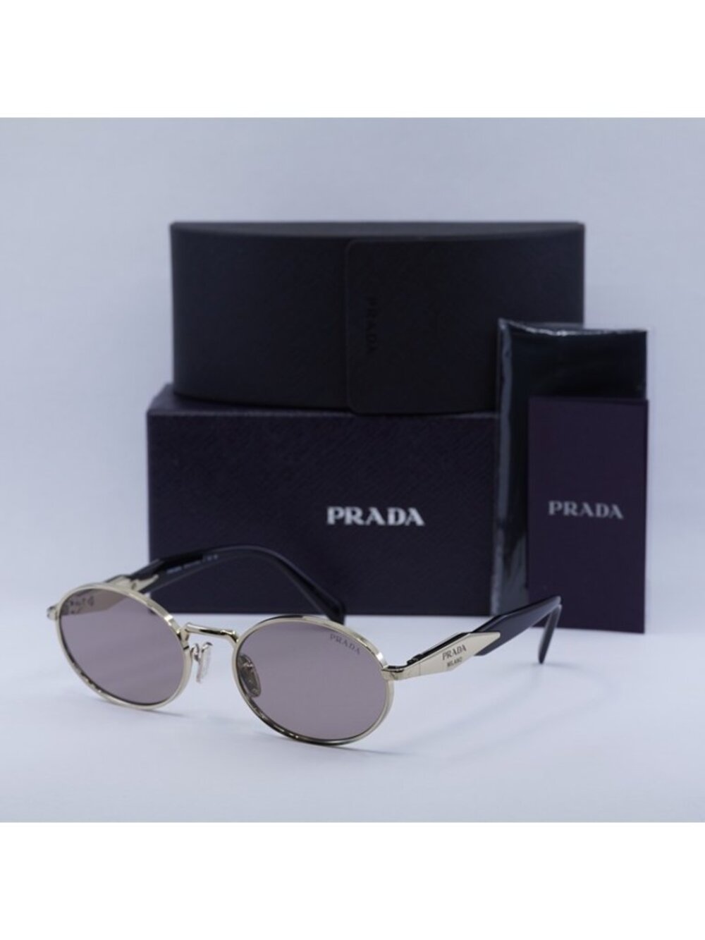 Prada PR65ZS ZVN20I Sunglasses Pale Gold Oval Frame, Light Purple Brown Lenses - Picture 12 of 12